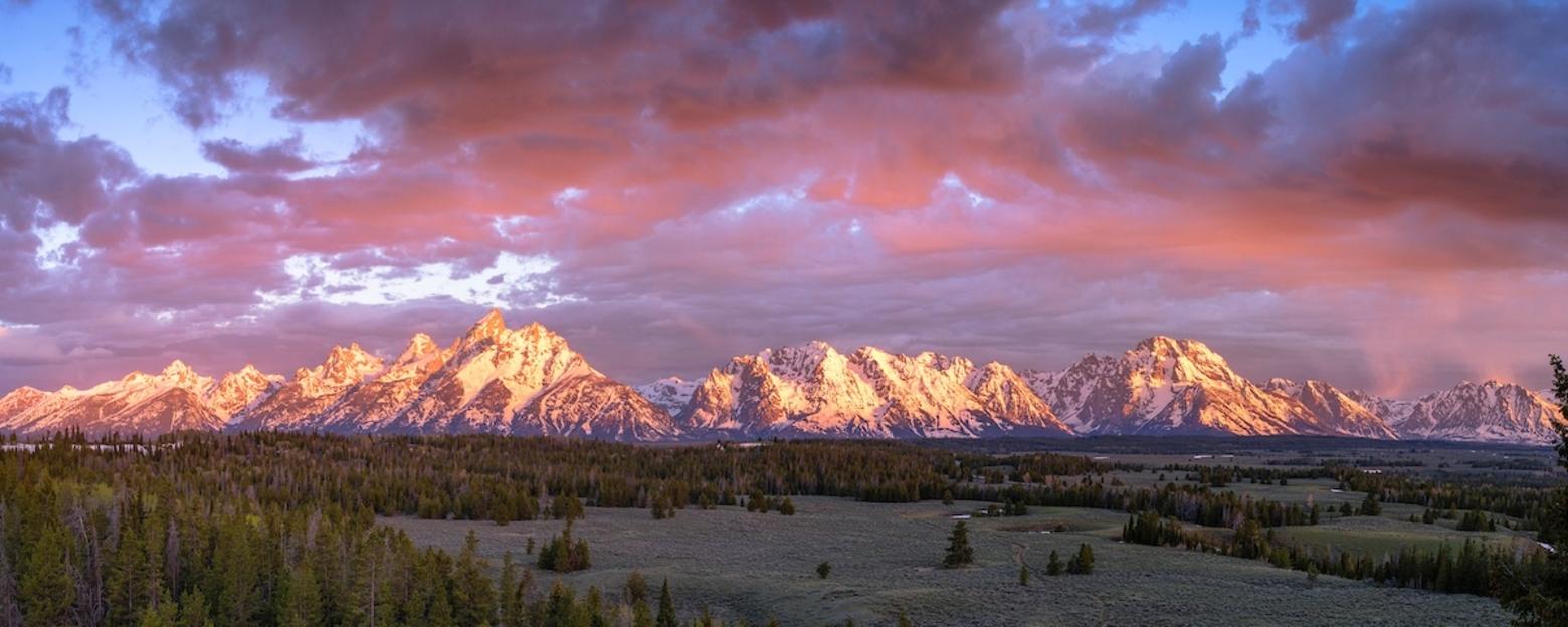 The Teton Range and Grand Teton National Park aglow. Photo by Charlie Lansche/LastChanceGallery.com