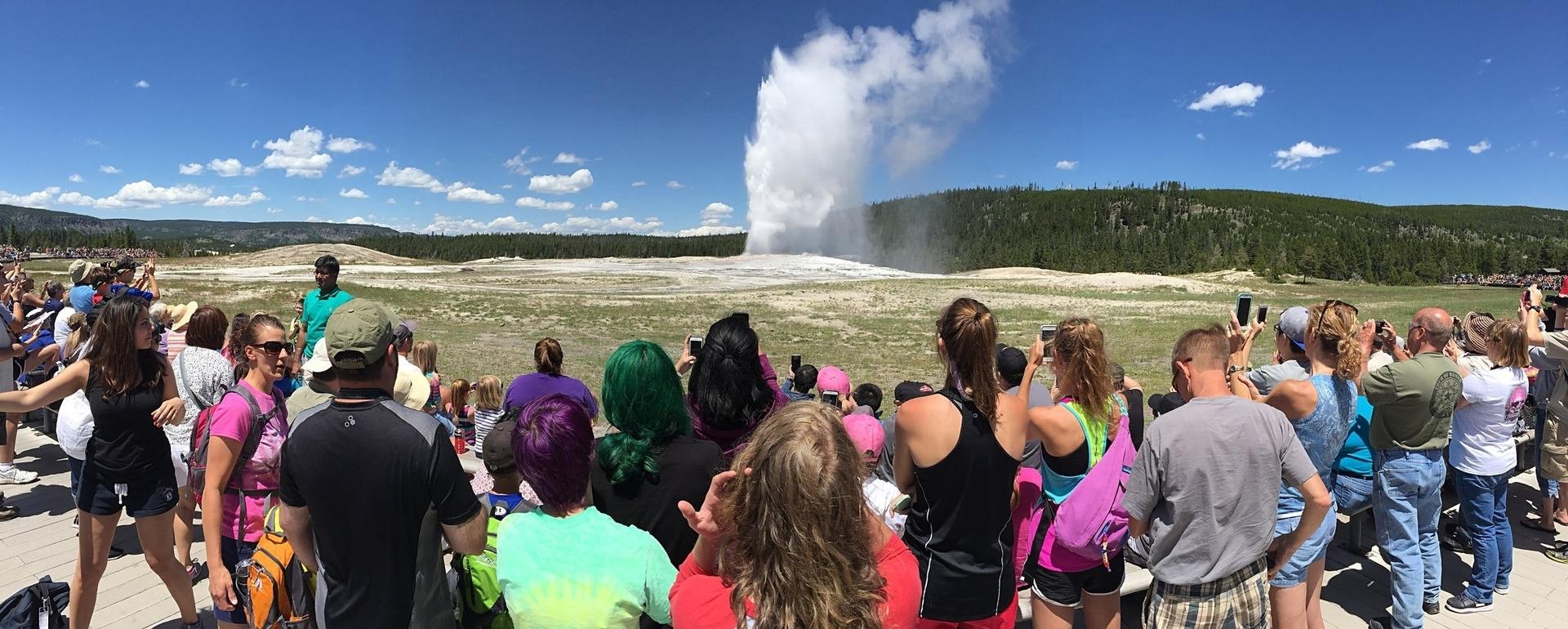 Crowds train eyes and iPhones on Old Faithful in Yellowstone National Park